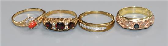 A Victorian style 9ct gold, garnet and diamond half-hoop ring and three other gem-set 9ct gold rings